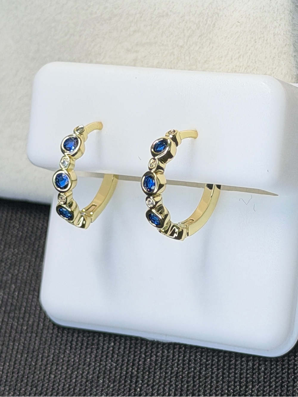 18 karat triple plated gold, sapphire, and chrysal small huggy earrings